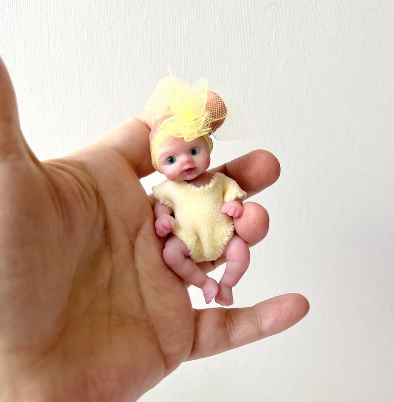mini silicone baby doll with open eyes